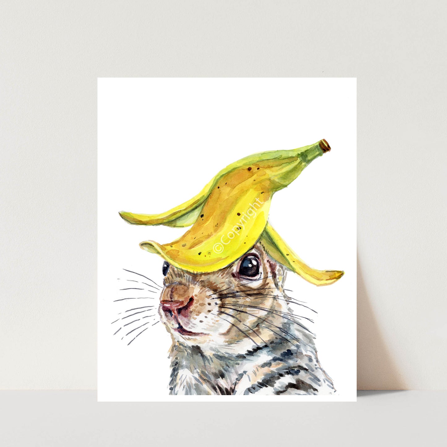 Illustration of a squirrel with a banana on its head against a white background
