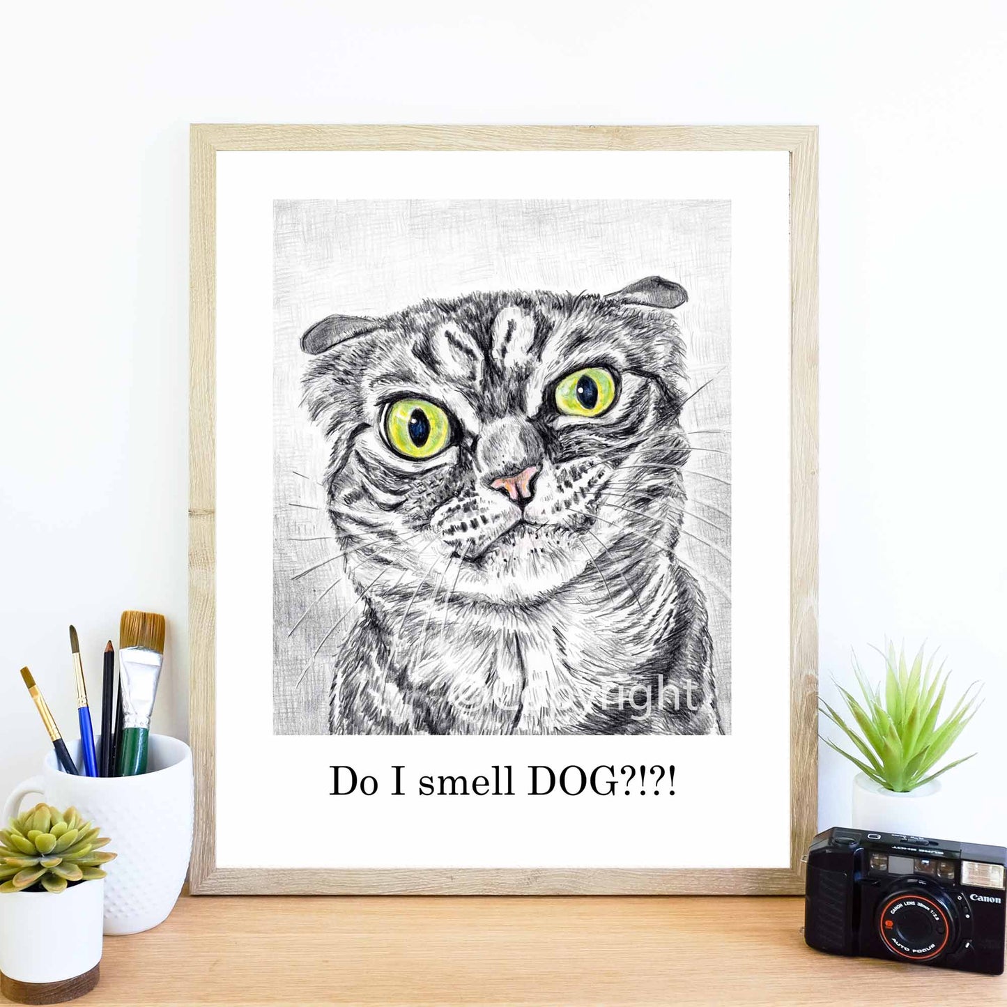 Crayon drawing of a disgruntled tabby cat who knows you were petting a dog. Art by Deidre Wicks