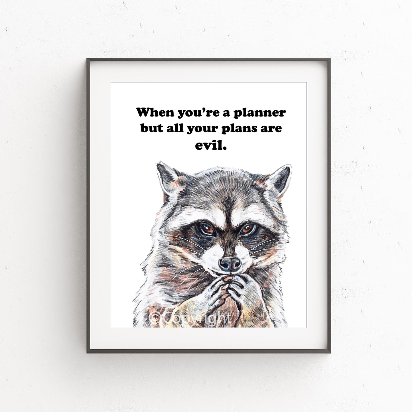 Crayon drawing of raccoon who is planning his next evil scheme. Art by Deidre Wicks
