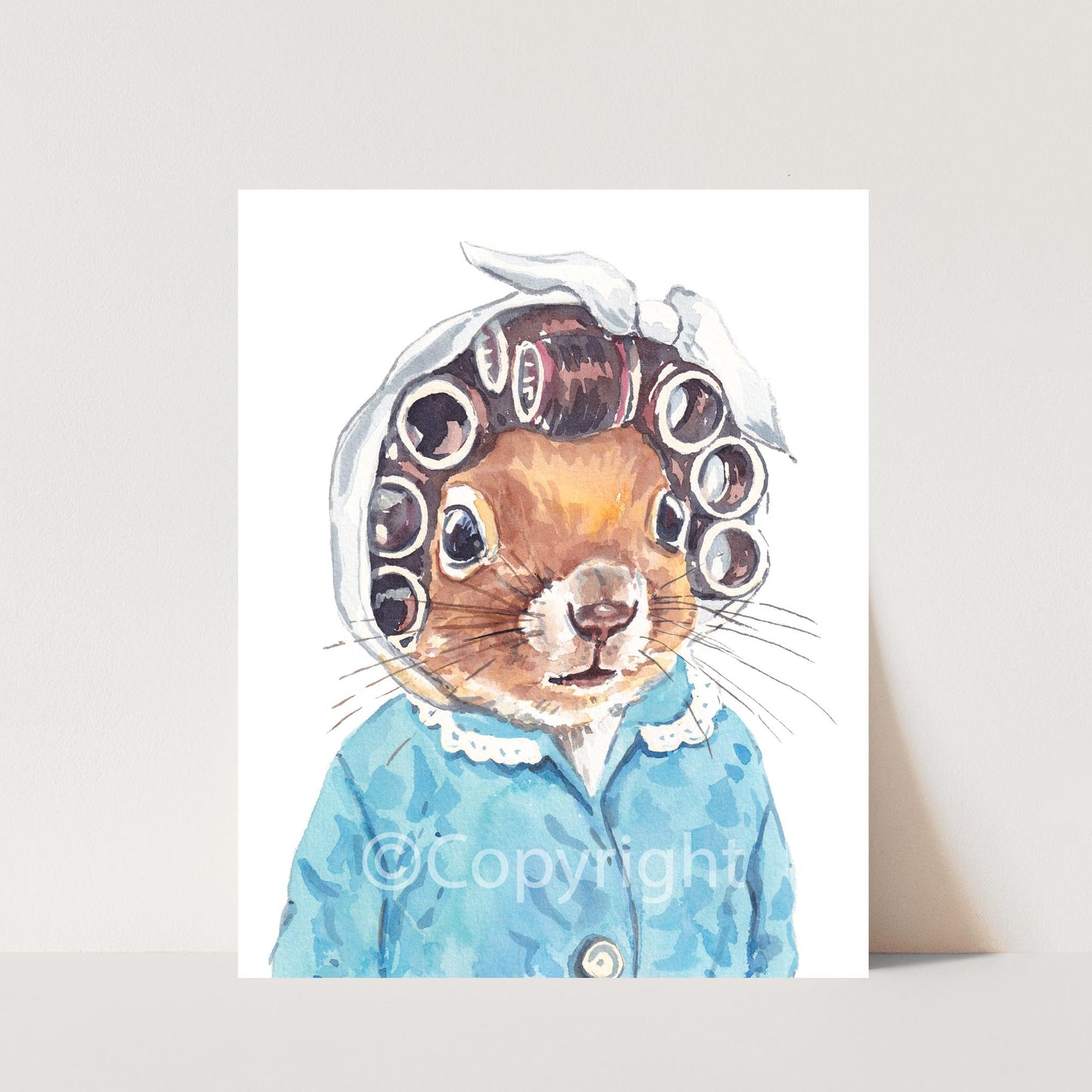 Watercolour painting of a squirrel wearing vintage hair curlers and a quilted housecoat. Art by Deidre Wicks