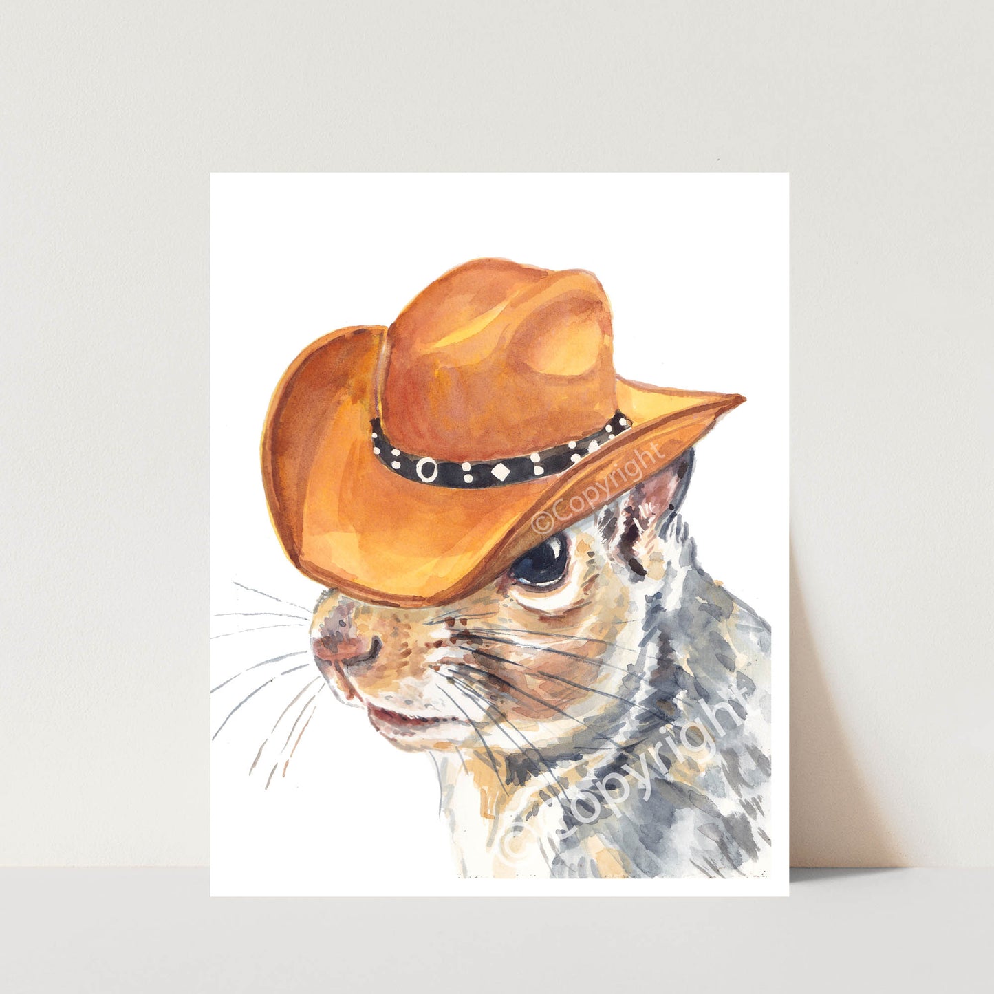 Watercolour painting of an Eastern grey squirrel wearing a brown cowboy hat.
