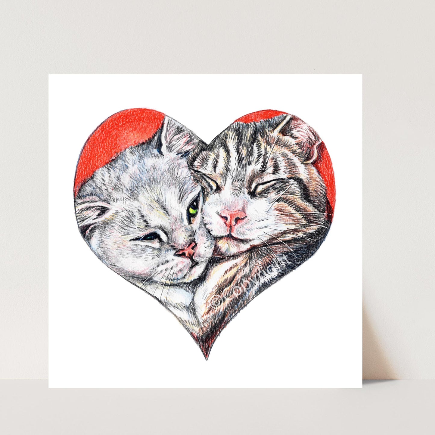 Coloured pencil drawing of a pair of bonded tabby cats shaped like a heart. Art by Deidre Wicks