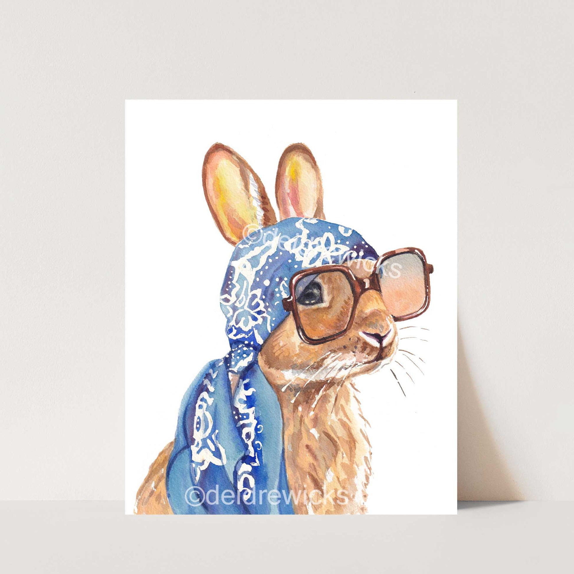 Watercolour painting of a brown bunny rabbit wearing a vintage scarf and big sunglasses. Vacation time! Art by Deidre Wicks
