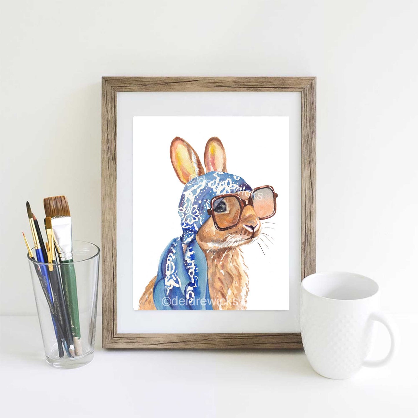 Watercolour painting of a brown bunny rabbit wearing a vintage scarf and big sunglasses. Vacation time! Art by Deidre Wicks