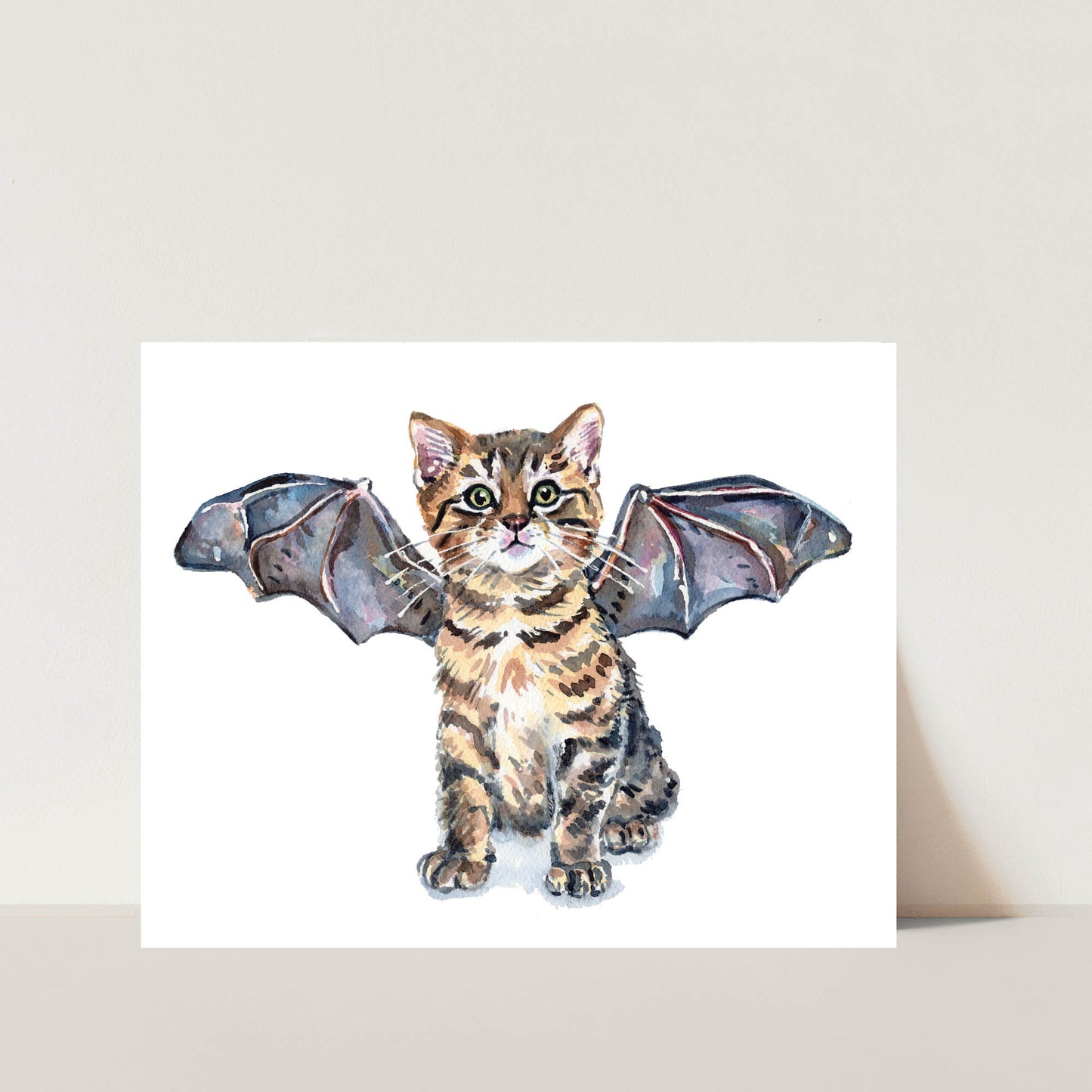 Original watercolour painting of a brown tabby kitten cat wearing bat wings