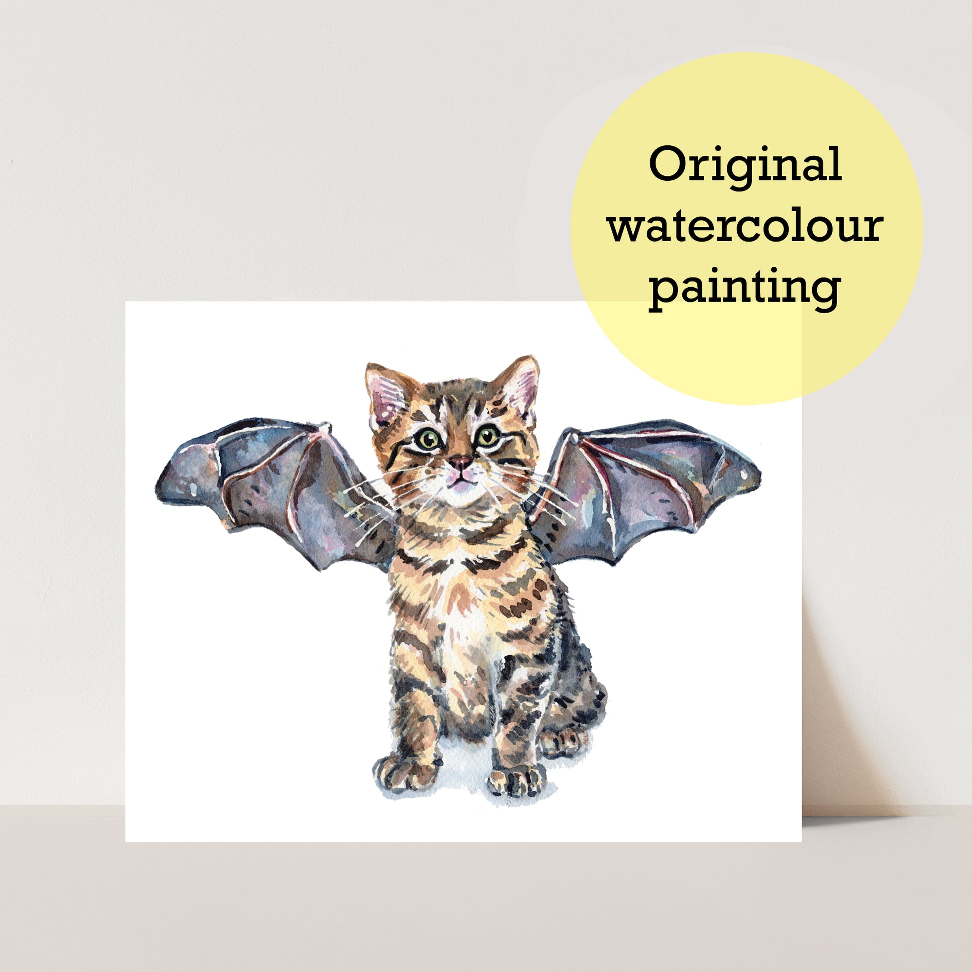 Original watercolour painting of a brown tabby kitten cat wearing bat wings