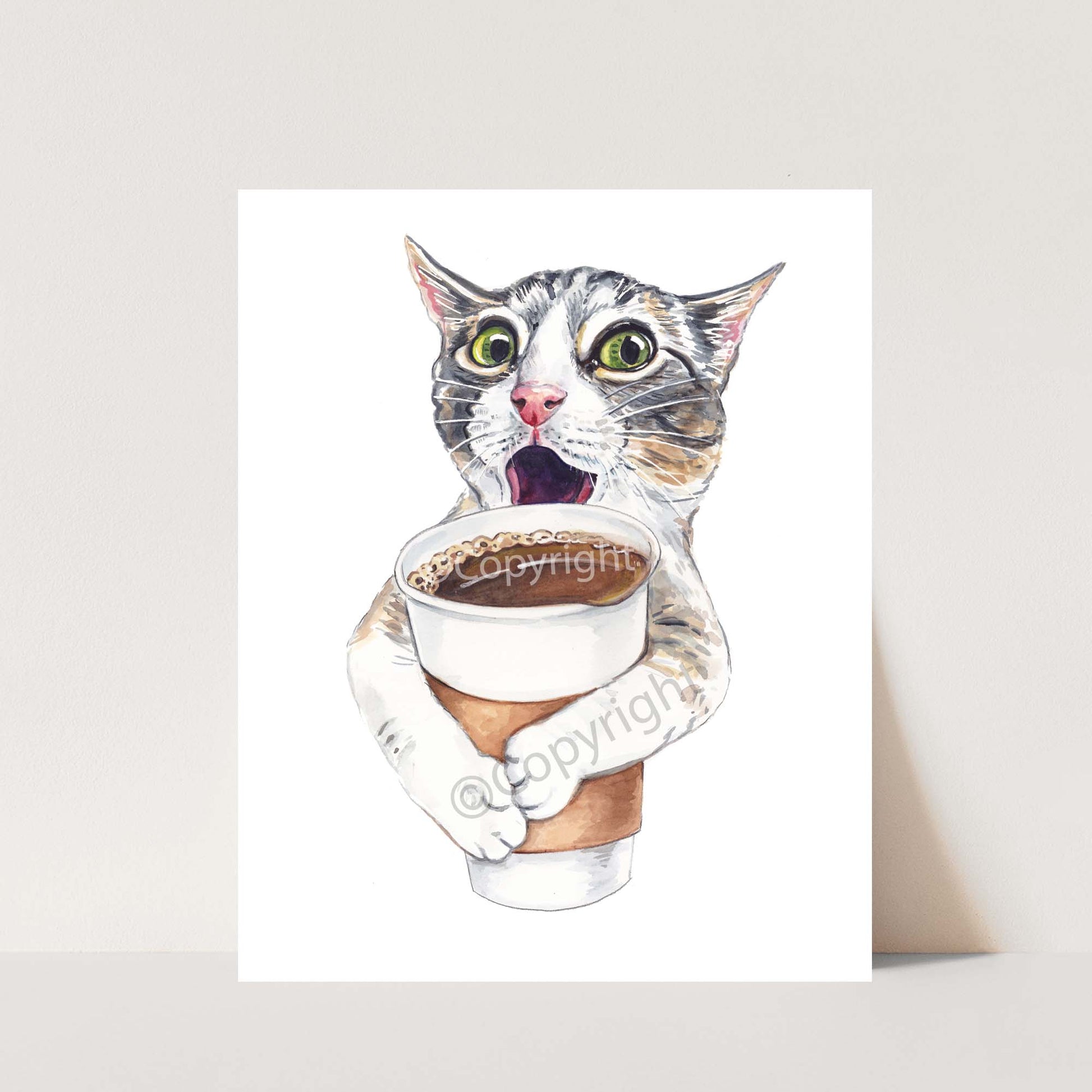 Watercolour painting of an excited tabby cat holding a large cup of coffee. Art by Deidre Wicks