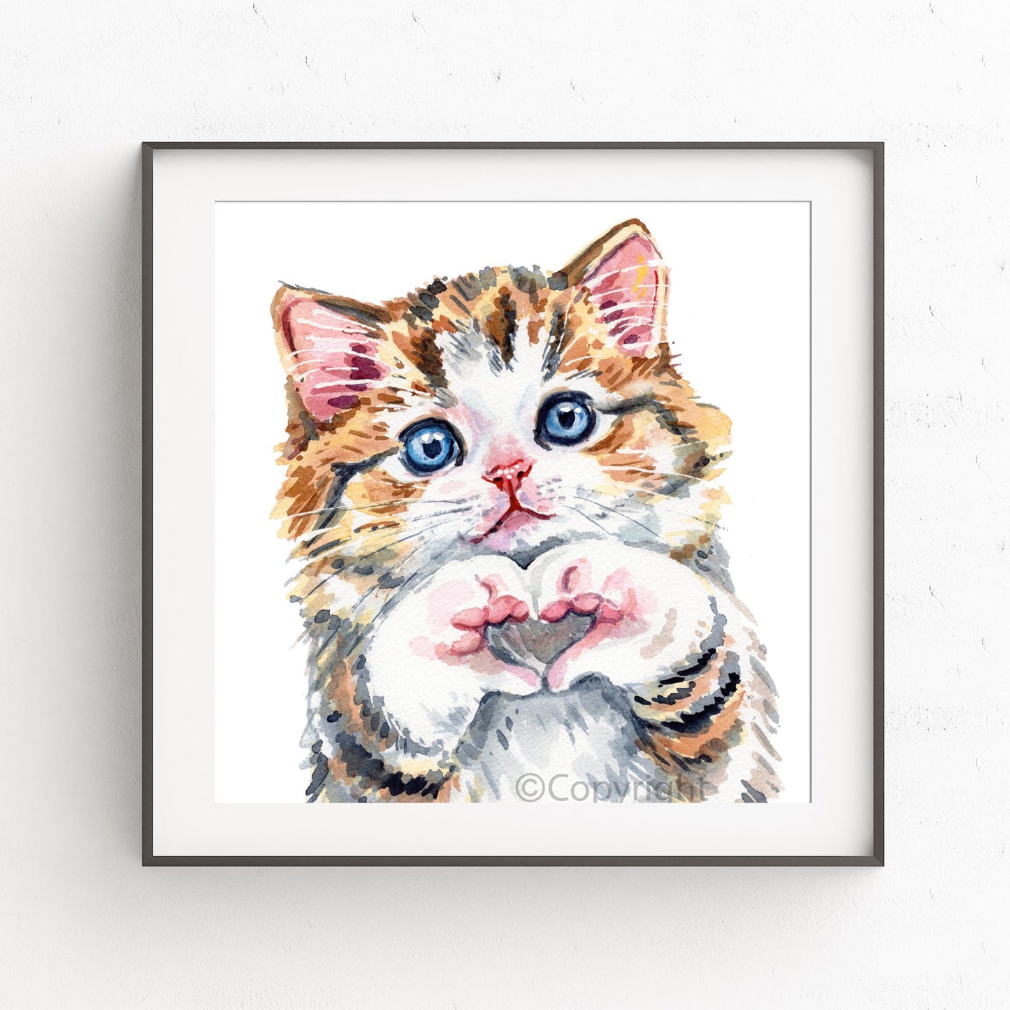 Watercolor painting of a calico cat with blue eyes forming a heart with his paws on a white background