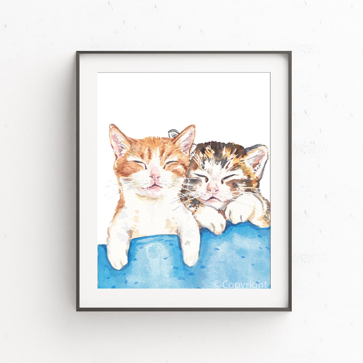 Watercolour painting of two tabby kittens taking a nap together. Art by Deidre Wicks