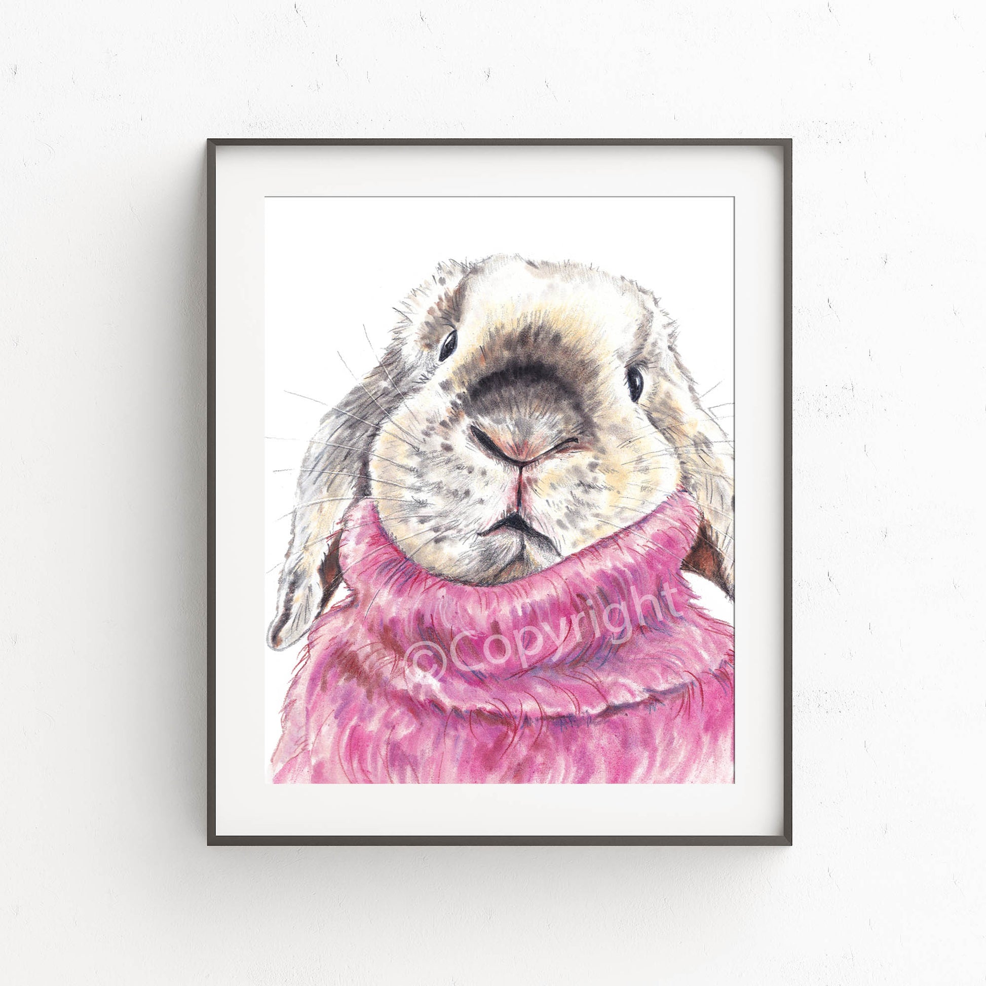 Pastel drawing of a lop eared bunny rabbit wearing a pink mohair turtleneck sweater. Art by Deidre Wicks