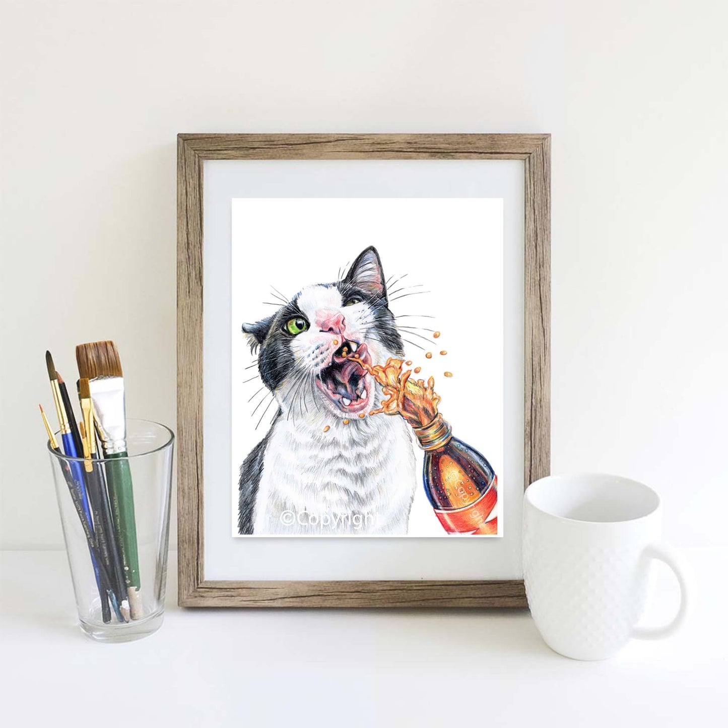 Coloured pencil drawing of a tuxedo cat drinking from a spraying bottle of soda pop. Art by Deidre Wicks