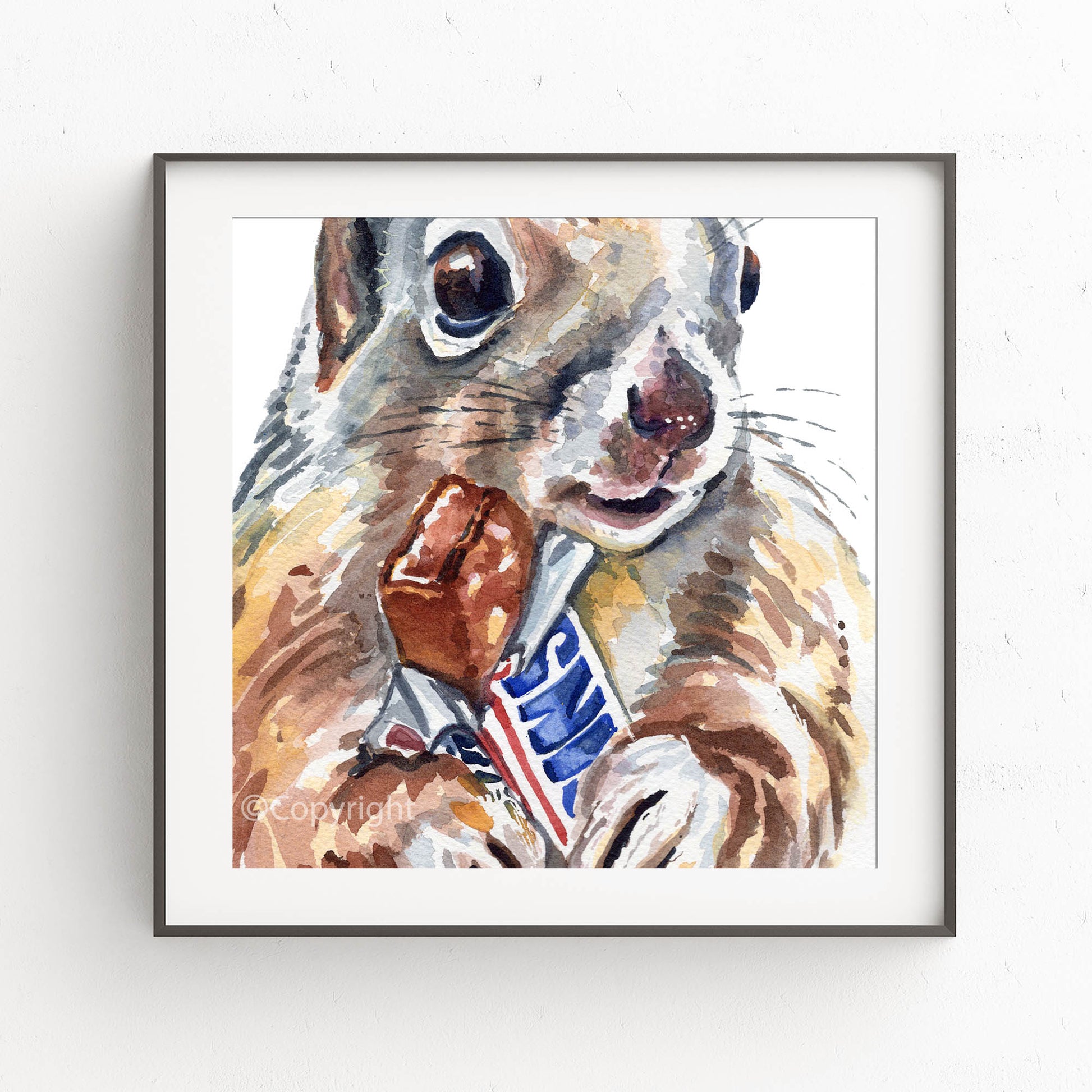 Framed artwork of a squirrel holding a candy bar on a white background