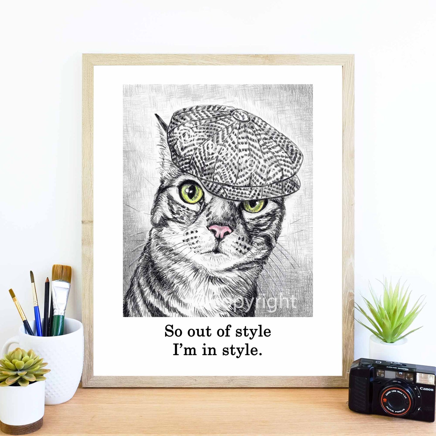 Vintage-inspired crayon drawing of a tabby cat wearing a newsboy cap by Deidre Wicks