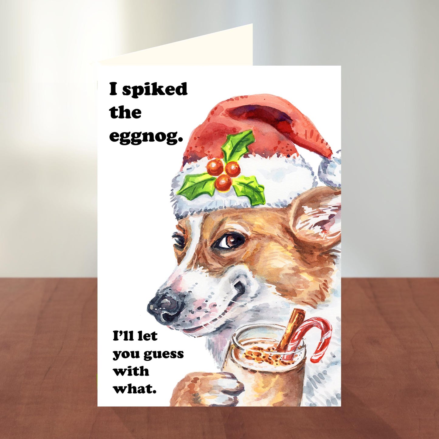 Christmas card with a dog wearing a Santa hat and eggnog, text 'I spiked the eggnog. I'll let you guess with what.'