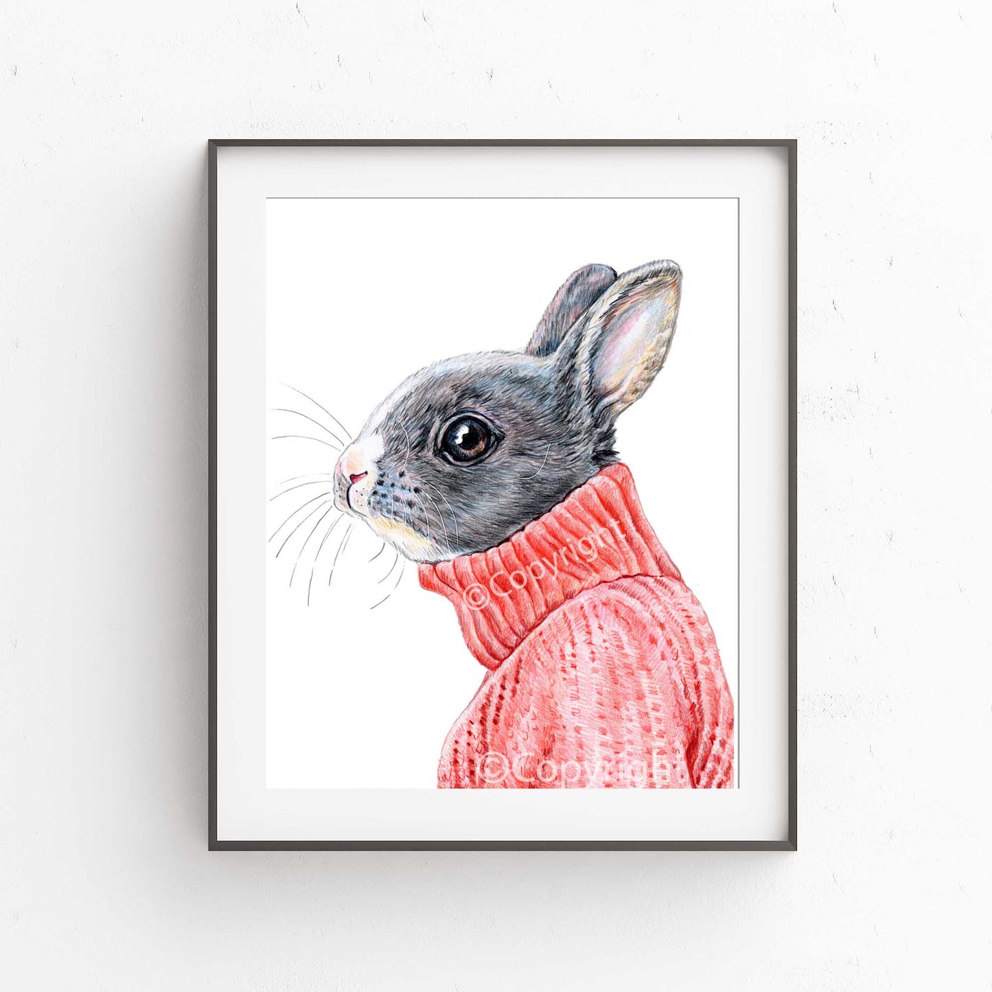 Coloured pencil drawing of a bunny rabbit wearing a red turtleneck sweater. Art by Deidre Wicks