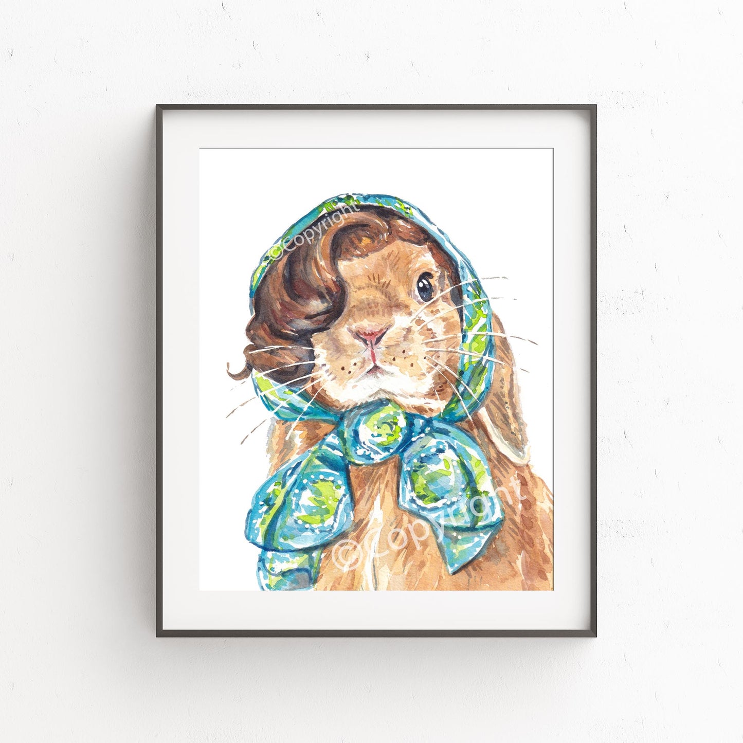 Watercolour painting of a lop eared bunny rabbit wearing a vintage head scarf. She's ready for a vacation. 
