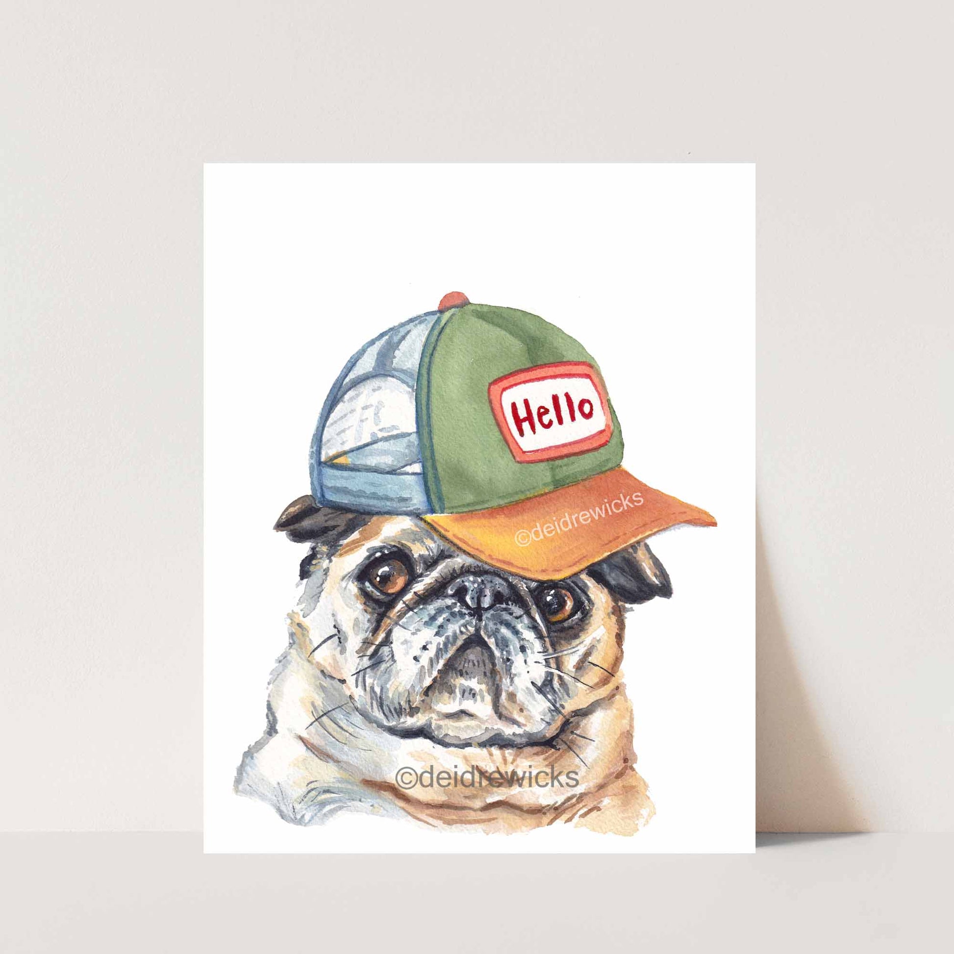 Watercolor print of a pug dog who is so shy he lets his baseball hat say hi for him. Art by Deidre Wicks