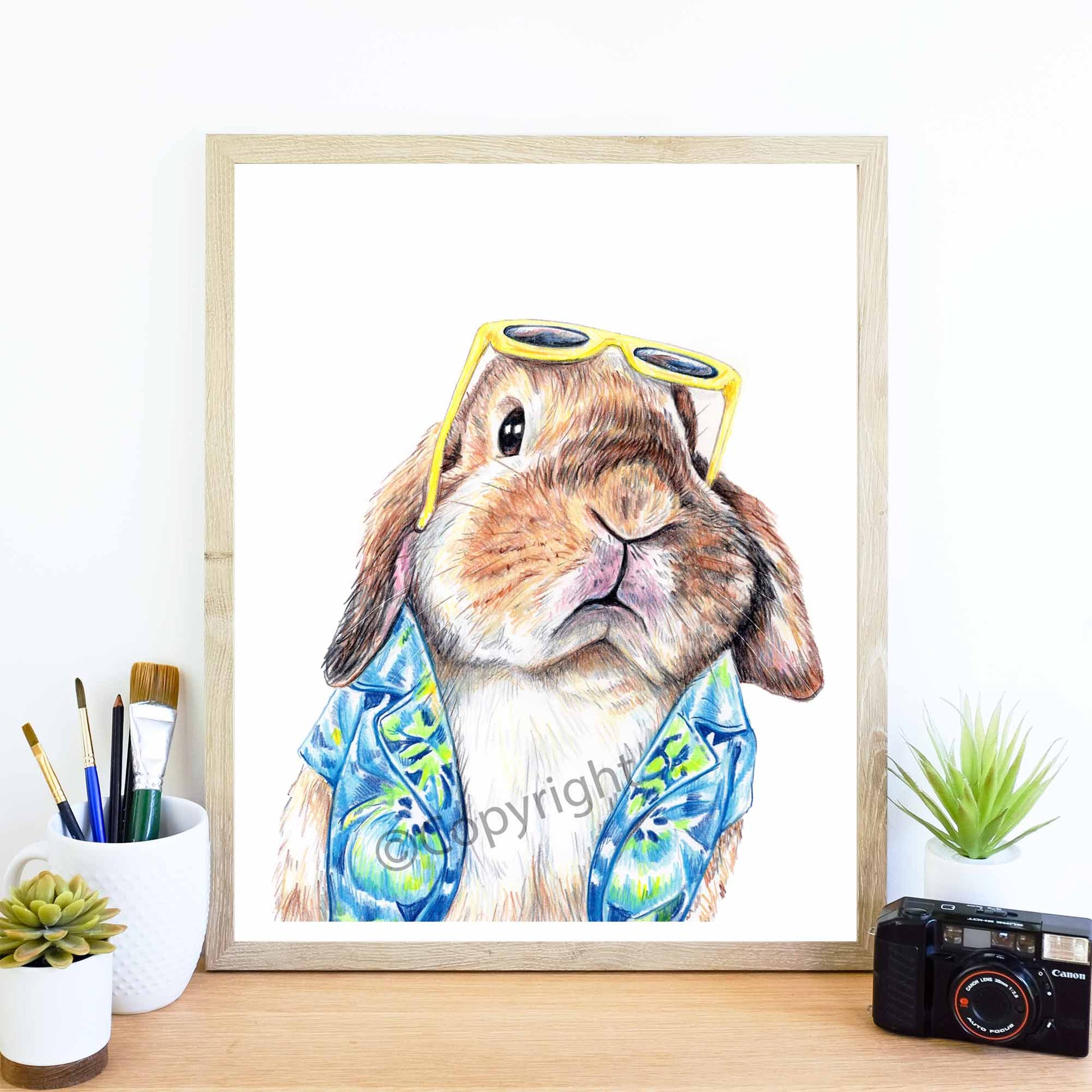 Print of drawing of a lop eared bunny rabbit wearing a Hawaiian shirt. Original crayon pastel drawing by Deidre Wicks