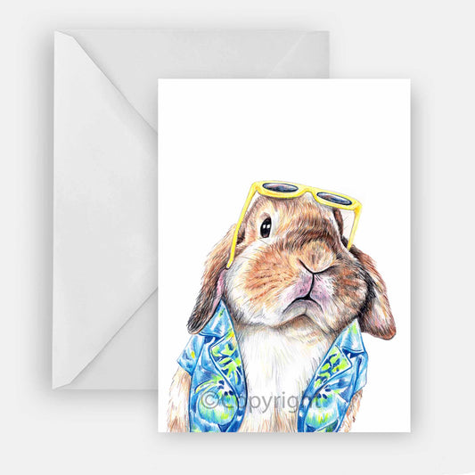 Blank greeting card featuring a lop eared bunny rabbit wearing a Hawaiian shirt. Art by Deidre Wicks