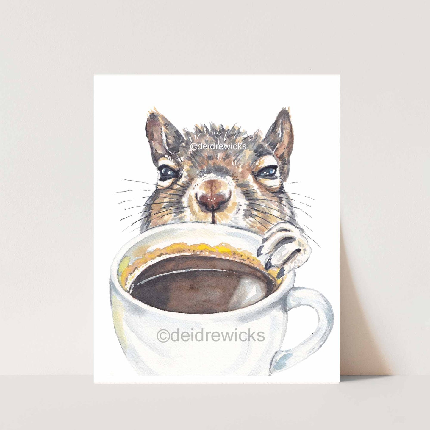 Watercolour painting of a bleary-eyed squirrel reaching for a cup of coffee. Original animal art by Deidre Wicks