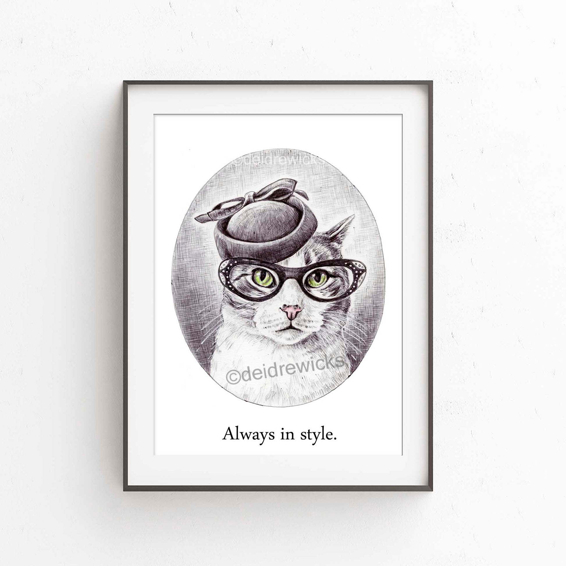 Framed example of a grey tabby cat wearing a vintage hat and glasses. Pen art by Deidre Wicks