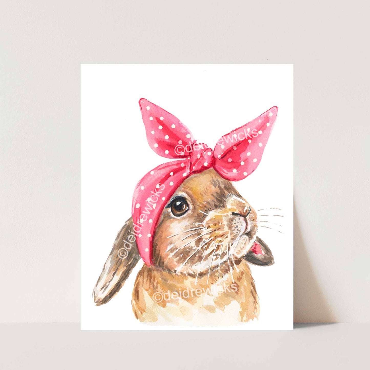 Watercolor print of a rabbit wearing a pink head scarf that looks like bunny ears