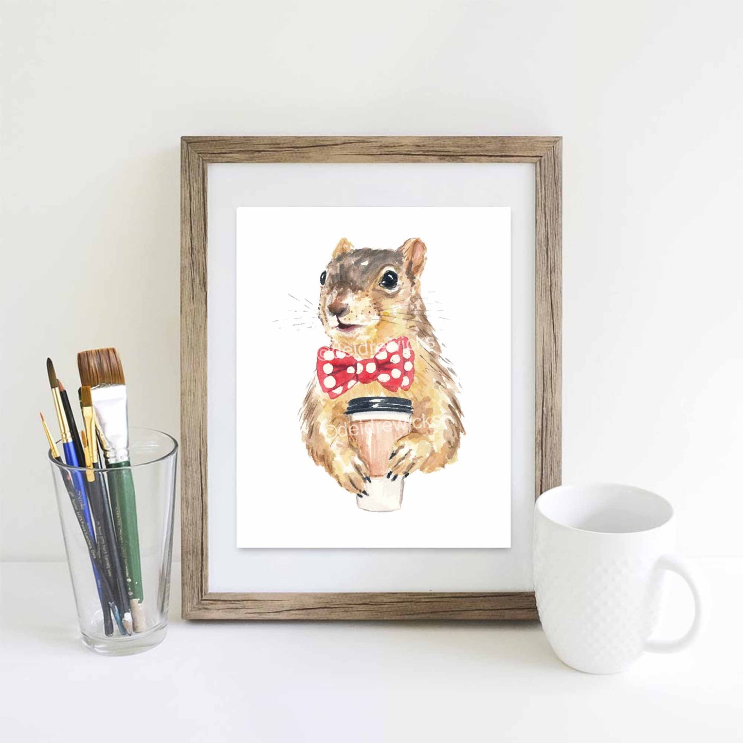 Framed example of a coffee squirrel watercolour print by Deidre Wicks. Comes in 3 sizes and is archival