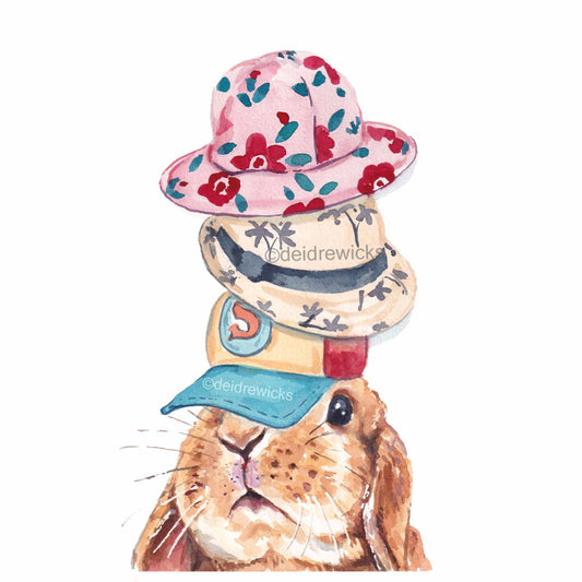 Watercolour painting of a lop eared rabbit wearing 3 different hats. Copyright Deidre Wicks
