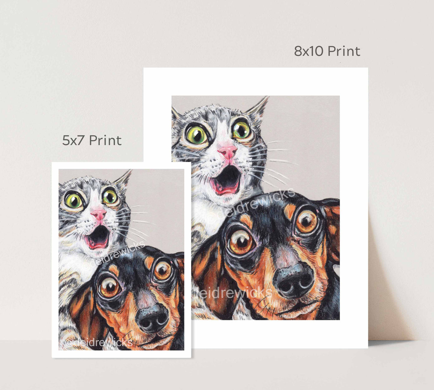 Size difference between prints of a tabby cat and dachshund dog by Deidre Wicks